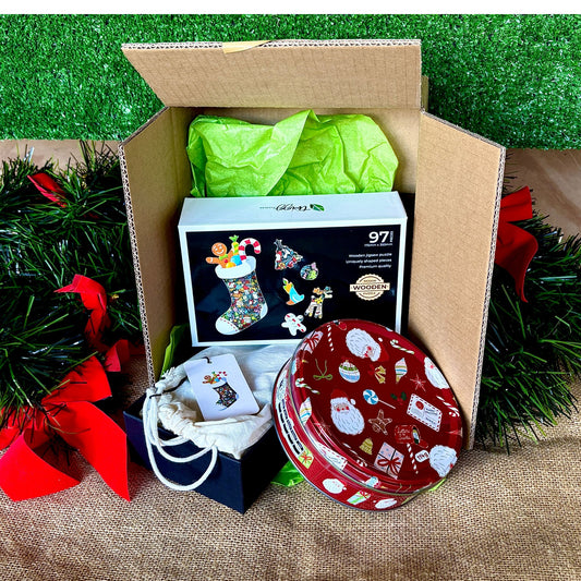 Christmas Stocking with a Christmas tin of biscuits