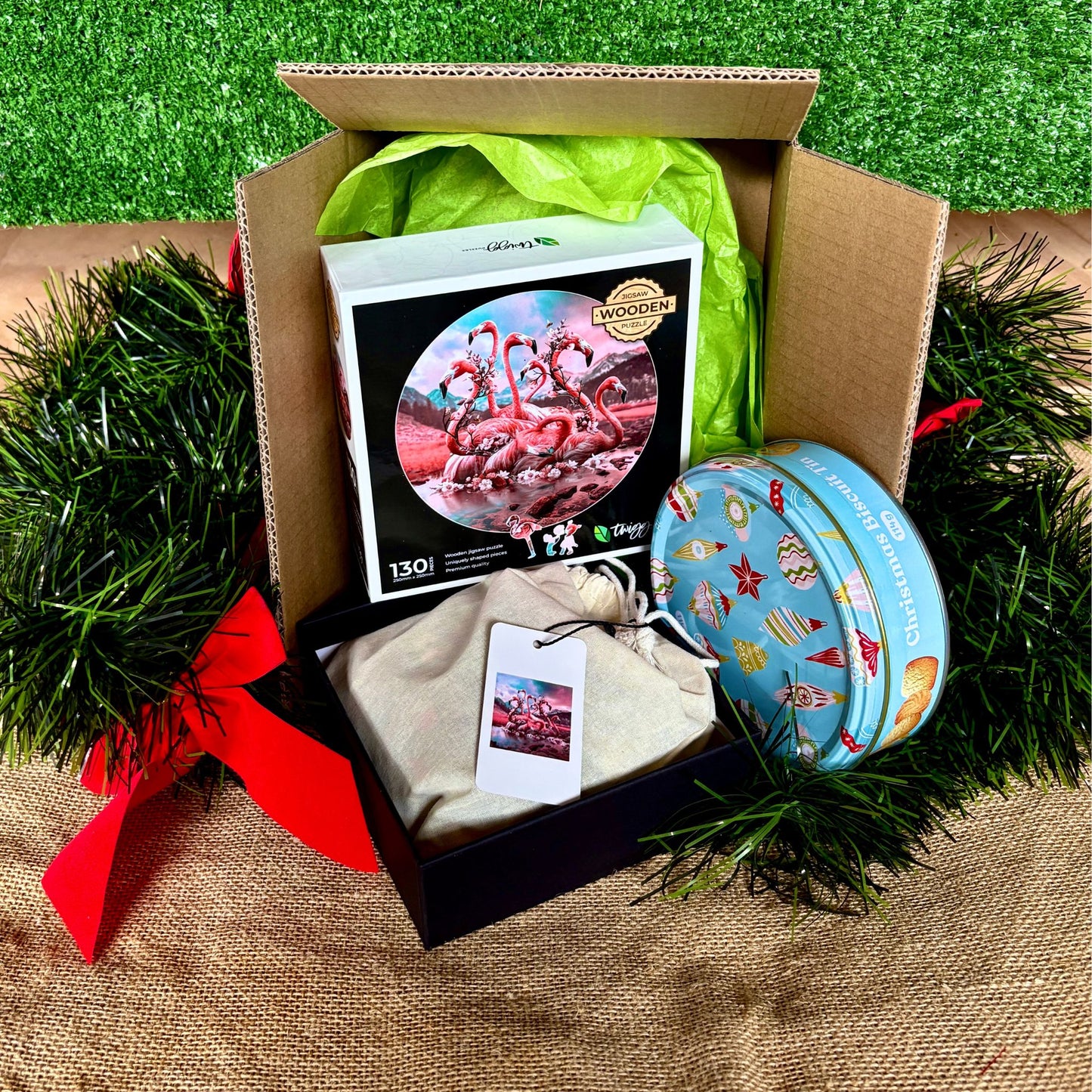 Flamingo with Christmas Tin of Biscuits