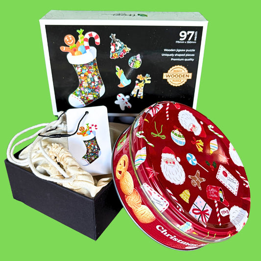 Christmas Stocking with a Christmas tin of biscuits